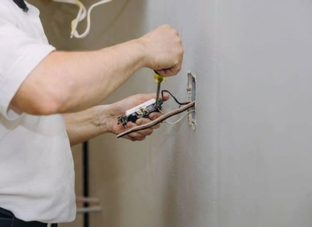 electrician sunrise fl installing an electrical light switch